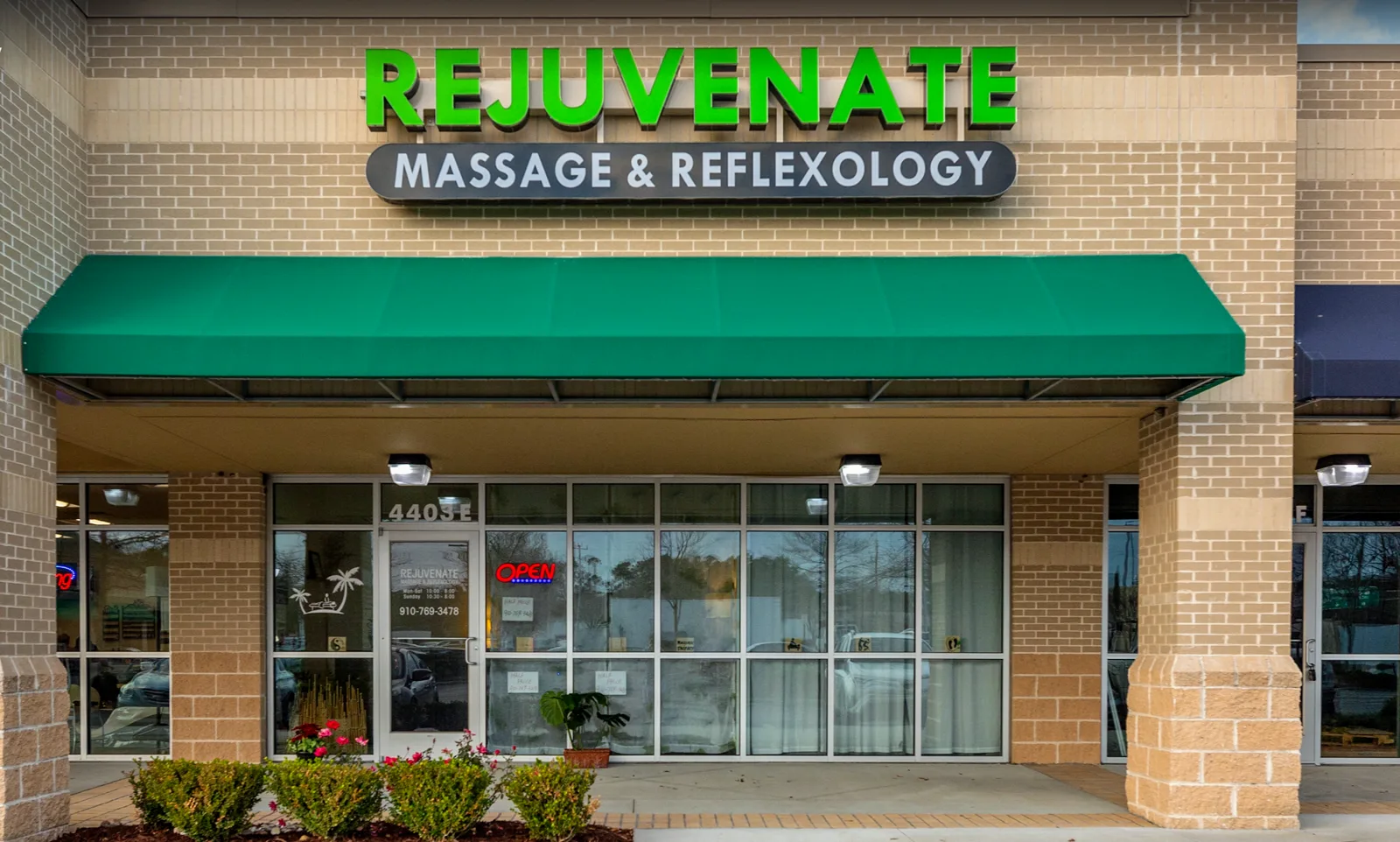 Rejuvenate Massage & Reflexology storefront with green awning